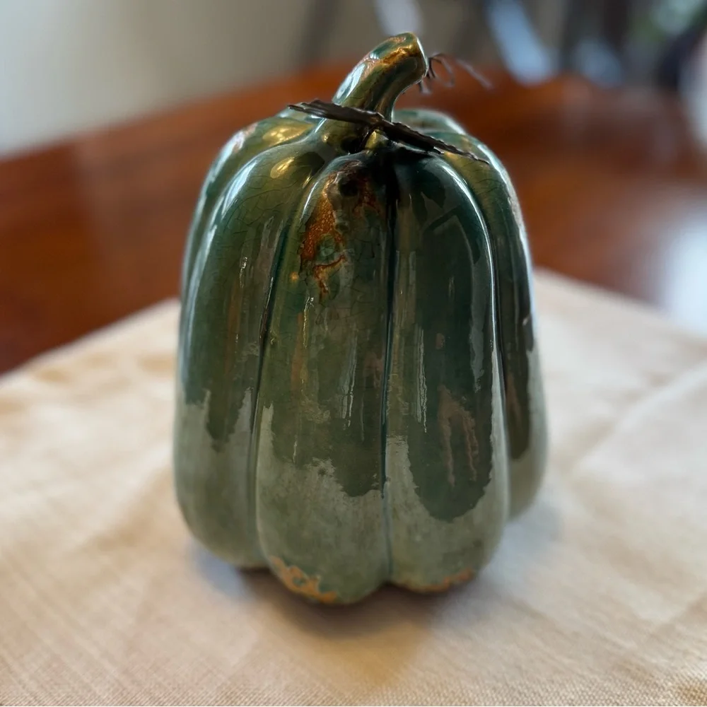 Ceramic pumpkin with metal leaf accent